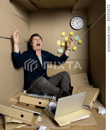 Mad businessman is expressing wrath from his work 38353472