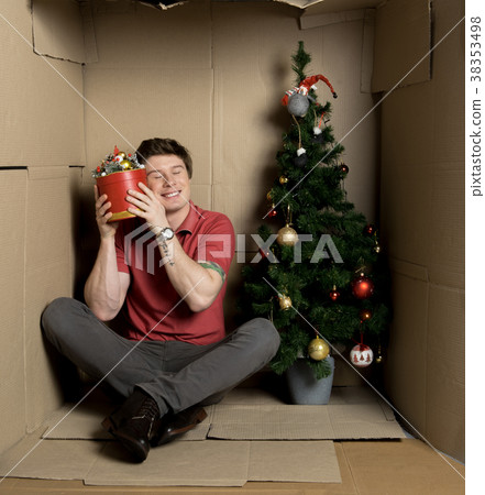 Young man is feeling delight while getting gift 38353498
