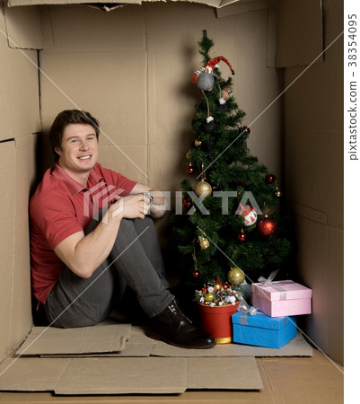 Cheerful guy is feeling happiness inside cramped 38354095