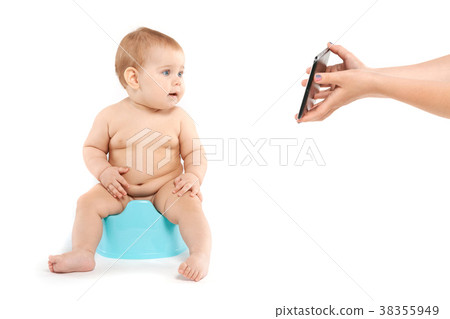 baby sitting on a pot baby sitting on a pot 38355949