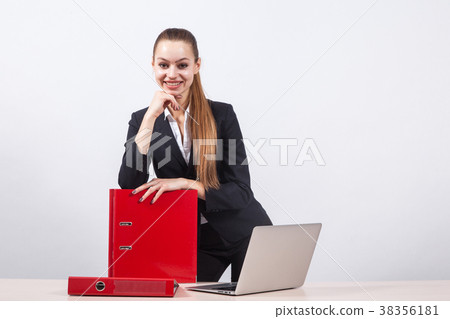 Stylish young business woman designer sites in a Stylish young business woman designer sites in a 38356181