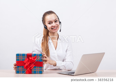 girl in a white blouse with a headset on his head 38356218