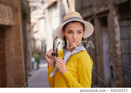 beautiful woman in summer dress walking and running joyful and c 38356557