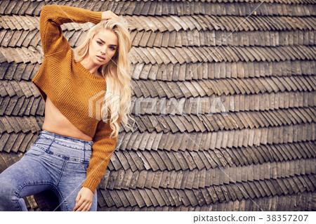 Outdoor fashion photo of young beautiful lady surrounded autumn Outdoor fashion photo of young beautiful lady surrounded autumn 38357207