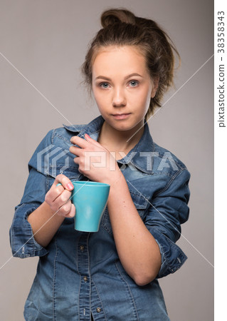 studio portrait of a sleepy woman in an orange studio portrait of a sleepy woman in an orange 38358343