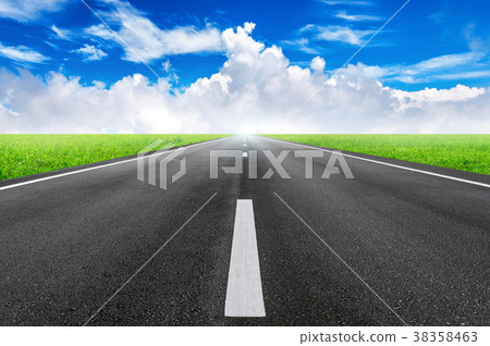 A long straight road and blue sky. A long straight road and blue sky. 38358463