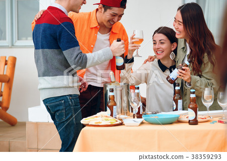 Men and women sharing house image enjoying a party 38359293