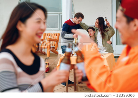 Men and women sharing house image enjoying a party Men and women sharing house image enjoying a party 38359306