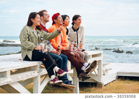 Men and women enjoying parties at the seaside Men and women enjoying parties at the seaside 38359308