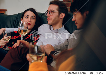Shared House Party Men and women enjoying alcohol Shared House Party Men and women enjoying alcohol 38359357