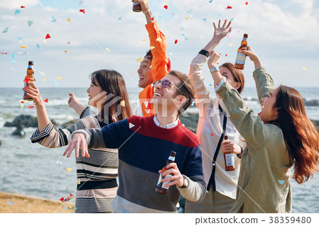 Men and women enjoying parties at the seaside 38359480
