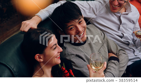 Shared House Party Men and women enjoying alcohol Shared House Party Men and women enjoying alcohol 38359514