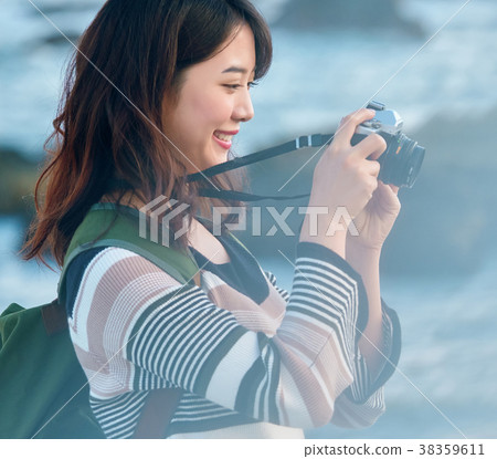 Woman seaside trip photography 38359611