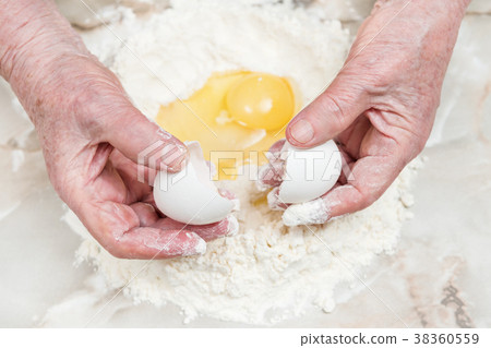 Hands grandmother prepare dough Hands grandmother prepare dough 38360559