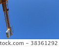 Construction site crane which shines in blue sky 38361292