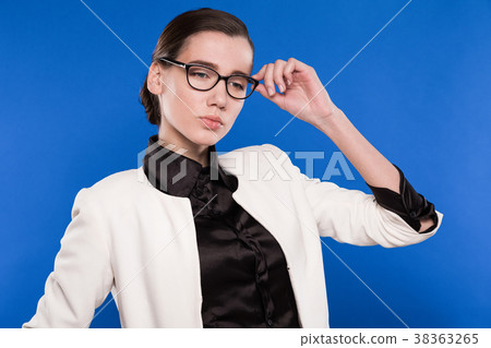 girl with glasses on a blue background girl with glasses on a blue background 38363265