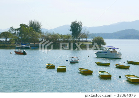 fishing and motor boats on the lake with blue sky fishing and motor boats on the lake with blue sky 38364079