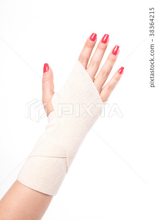 studio shot female wrists tied with an elastic 38364215