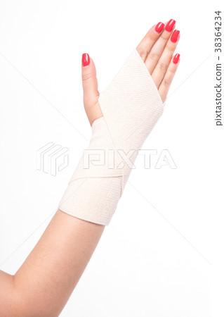 studio shot female wrists tied with an elastic 38364234