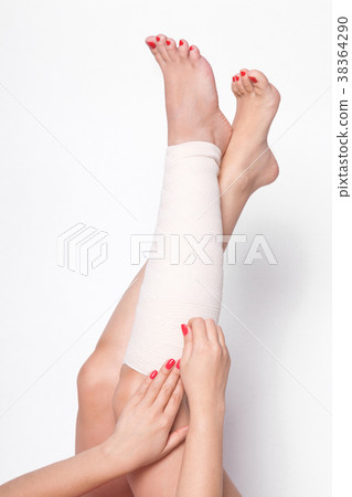 girl on a white background corrects an elastic girl on a white background corrects an elastic 38364290