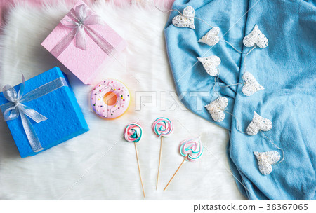 Gifts and candies locating on carpet Gifts and candies locating on carpet 38367065