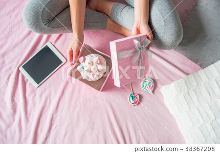 Woman hands holding Easter cake in gift 38367208