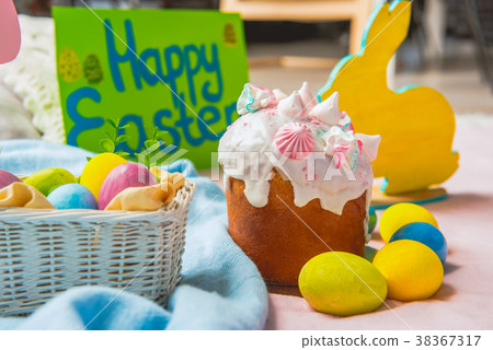 Delicious cake and colored eggs 38367317