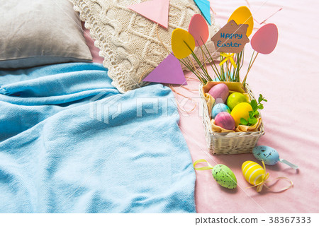 Colored painted eggs in pottle 38367333