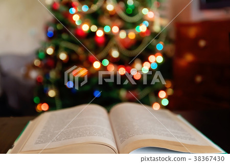Christmas and bible with blurred candles light Christmas and bible with blurred candles light 38367430