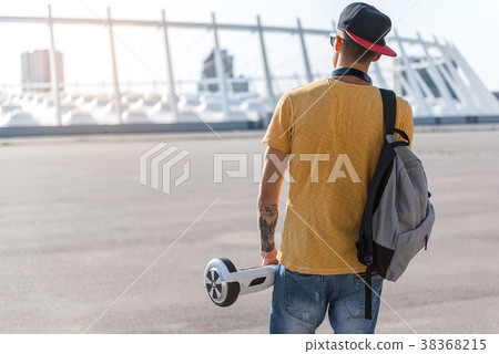 Man holding digital device in hand Man holding digital device in hand 38368215