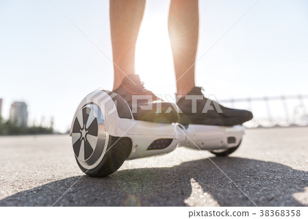 Man legs riding on gyroscope 38368358