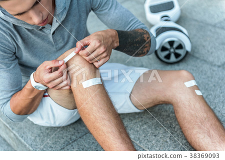 Man using patches at street 38369093