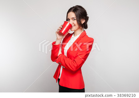 Picture of attractive woman in red dress with cup Picture of attractive woman in red dress with cup 38369210