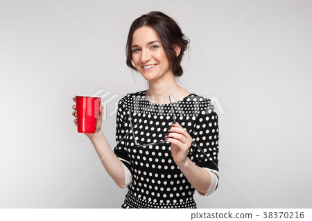 Picture of attractive woman in speckled clothes 38370216