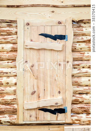 Traditional russian wooden door in the house Traditional russian wooden door in the house 38370415