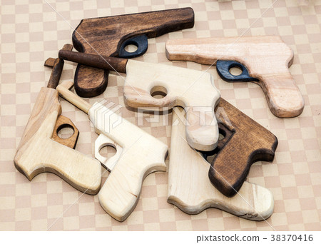 Different handmade wooden toy pistols for children Different handmade wooden toy pistols for children 38370416