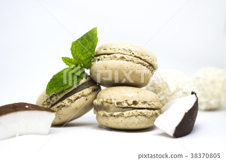 Macaroons with fresh coconut, mint leaves on white 38370805