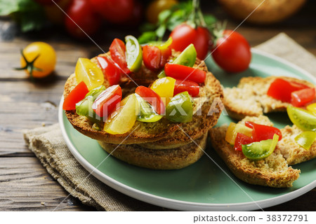 Traditional italian bread frisella with tomatos Traditional italian bread frisella with tomatos 38372791