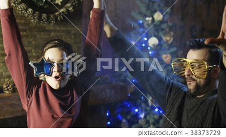 Excited man with son blowing up crackers 38373729