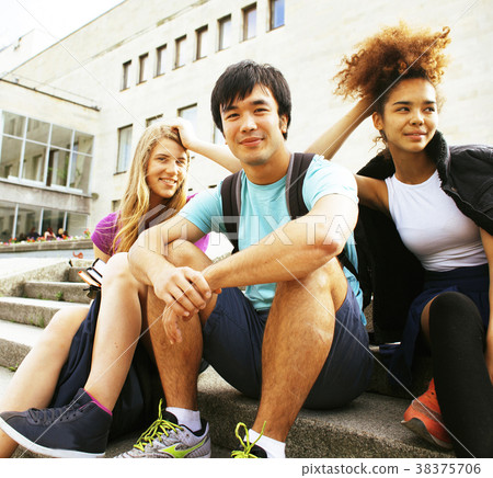 cute group of teenages at the building of 38375706