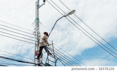 Working to install electric line 38376120
