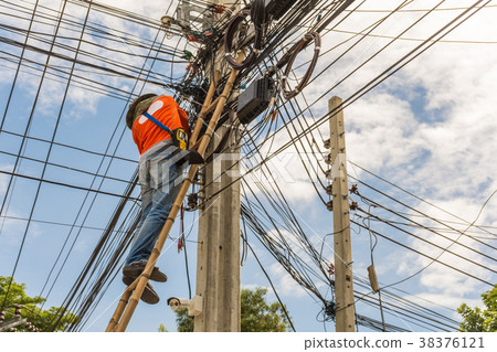 Working to install electric line 38376121