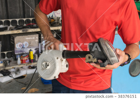 Checking car headlight 38376151