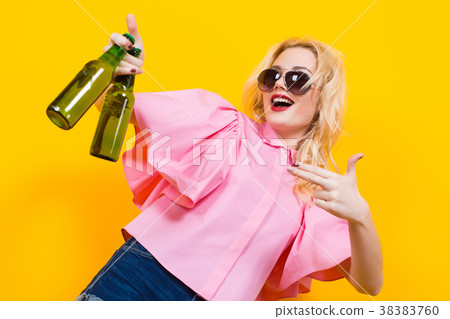 Woman in pink blouse with sunglasses and beer 38383760