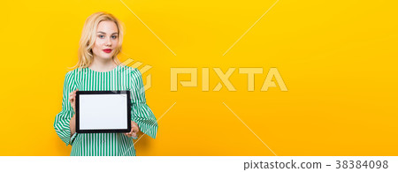 Blonde woman holding tablet computer 38384098