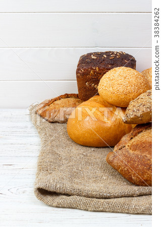 Bakery background, bread assortment. Rye buns Bakery background, bread assortment. Rye buns 38384262