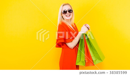 Blonde woman in dress with bags 38385599