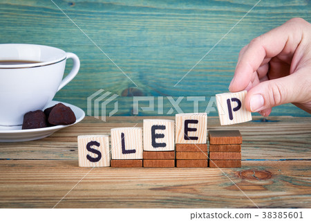 sleep. Wooden letters on the office desk, informative and communication background 38385601