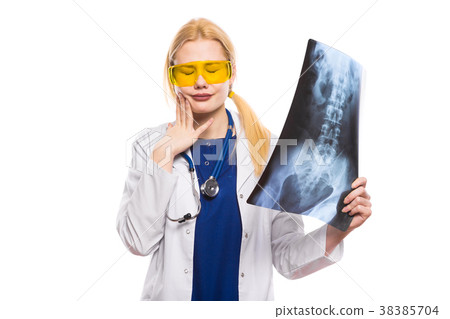 Woman doctor in white coat with X-ray Woman doctor in white coat with X-ray 38385704