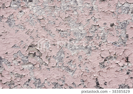 Pink paint coating with cracks on a dirty gray 38385829